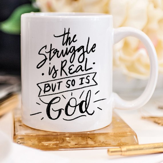 The Struggle Is Real But So Is God Mug by Magenta Shadow Coffee & Tea Cups