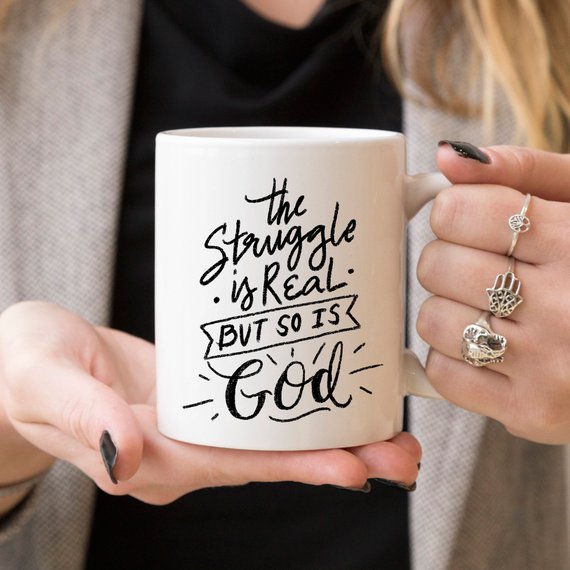 The Struggle Is Real But So Is God Mug by Magenta Shadow Coffee & Tea Cups