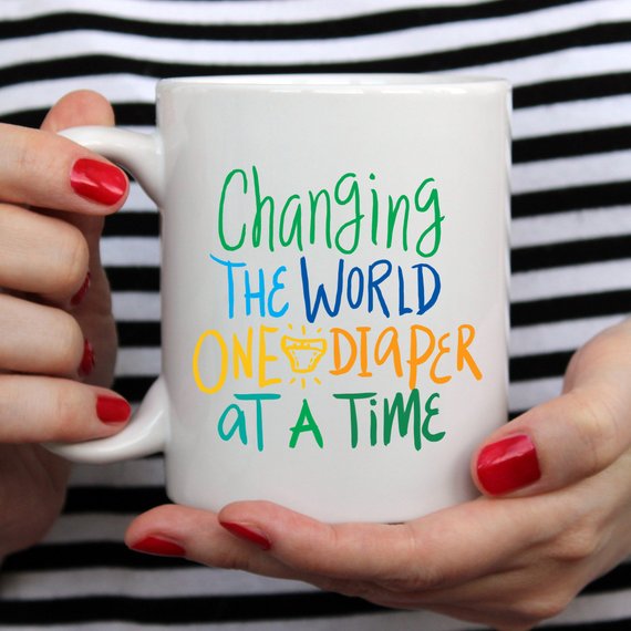 Changing The World One Diaper At A Time Mug by Magenta Shadow Coffee & Tea Cups