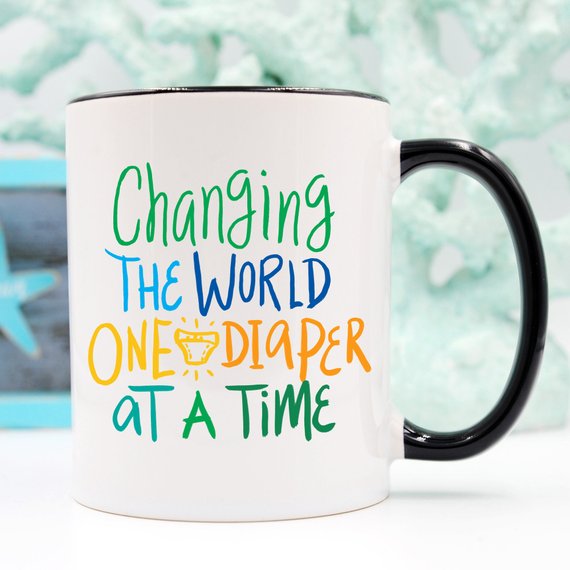 Changing The World One Diaper At A Time Mug by Magenta Shadow Coffee & Tea Cups
