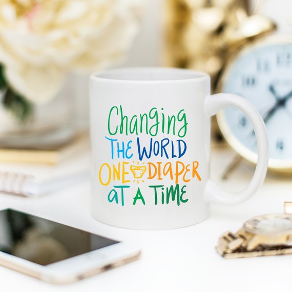 Changing The World One Diaper At A Time Mug by Magenta Shadow Coffee & Tea Cups